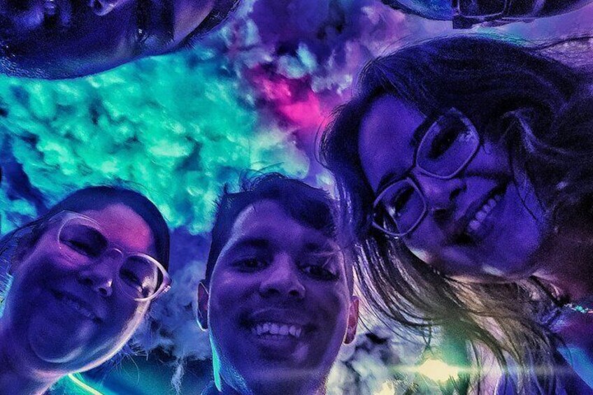 A group of people with their faces blurred, standing close together. 4