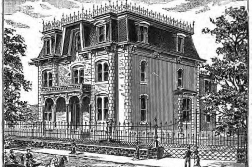 A large, ornate building with multiple stories and a prominent roofline. 4
