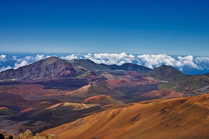 A mountainous landscape with a clear sky and clouds. 5