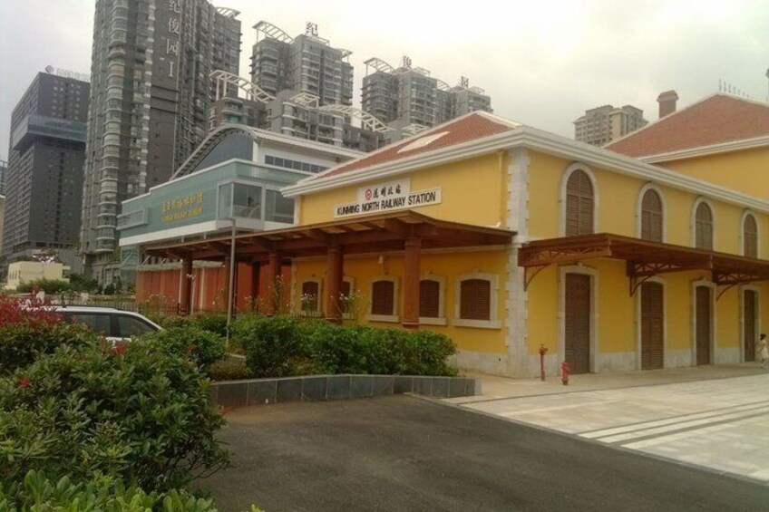 A yellow building labeled 'EMBARK NORTHWAY STATION' with a covered entrance and arched windows. 5
