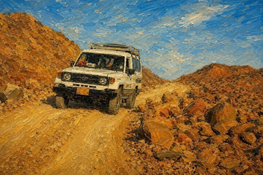 A white off-road vehicle on a rocky path with a clear sky. 5
