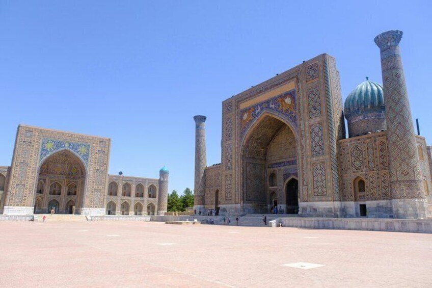 A large, ornate building with intricate tile work and a prominent dome. 4