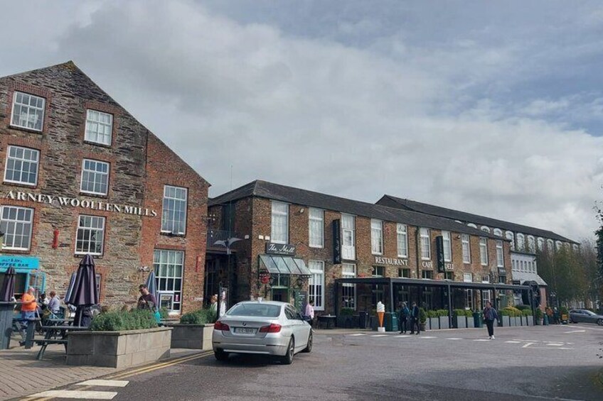 A street with a building labeled 'Arney Woollen Mills' and a restaurant named 'The Swan.' 3