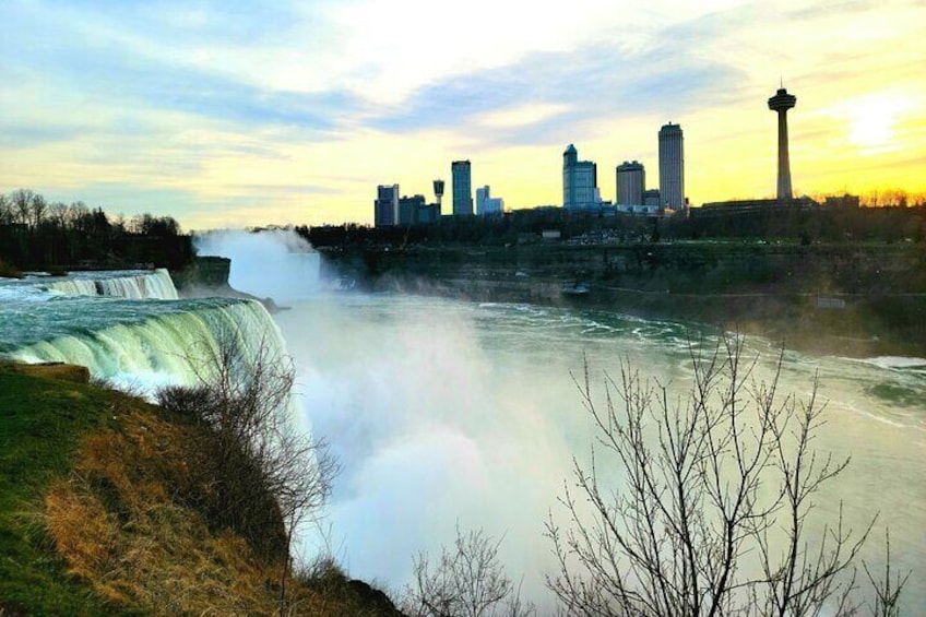 A waterfall, a city skyline, and a tower. 5
