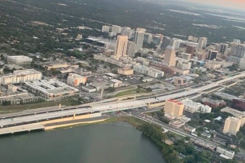 An aerial view of a city with a river, bridges, and high-rise buildings. 3