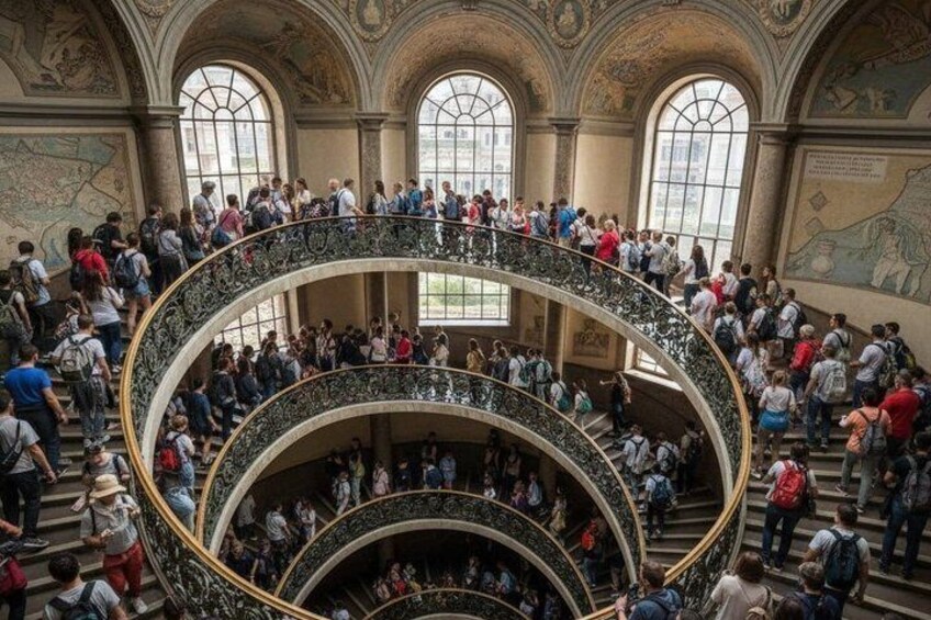 A multi-level atrium with people gathered on the upper levels. 2