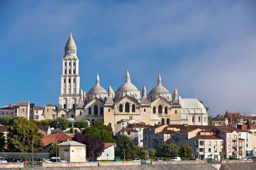 A historic cathedral with multiple domes and a tall bell tower. 1