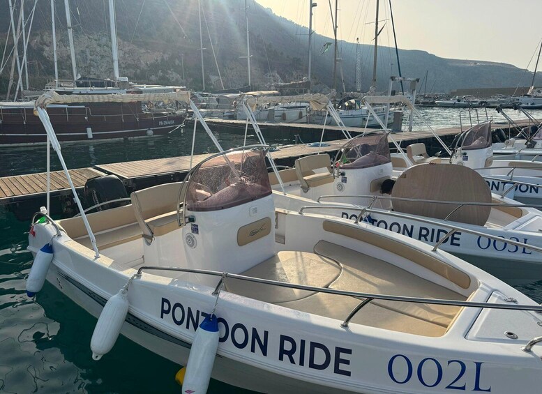 A marina with several boats docked, including one labeled 'PONTON RIDE 002L'. 4