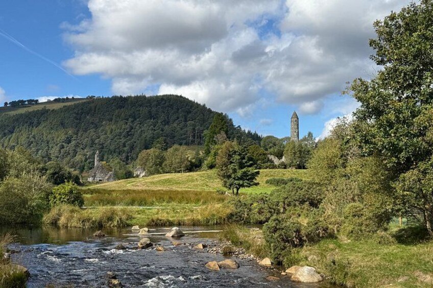 A river, a tower, and a forested hill. 1