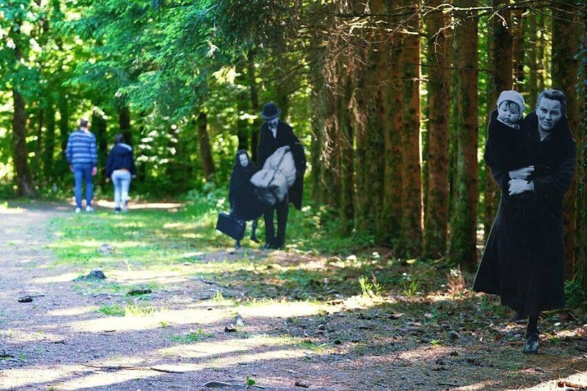 A forest path with people walking. 4