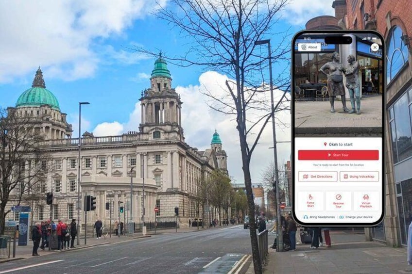 A historic building with domed towers, a smartphone displaying a navigation app, and a clear sky. 1