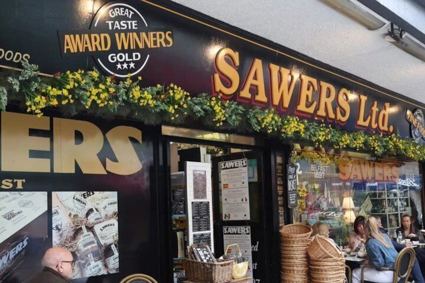 A storefront with the sign 'SAWERS Ltd.' and 'GREAT TASTE AWARD WINNERS GOLD' above it. 4