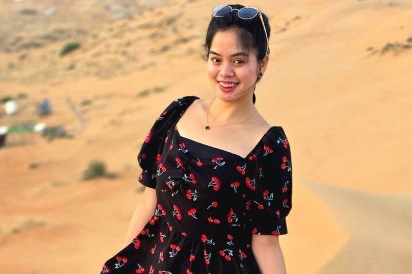 A person in a desert landscape with sand dunes. 4