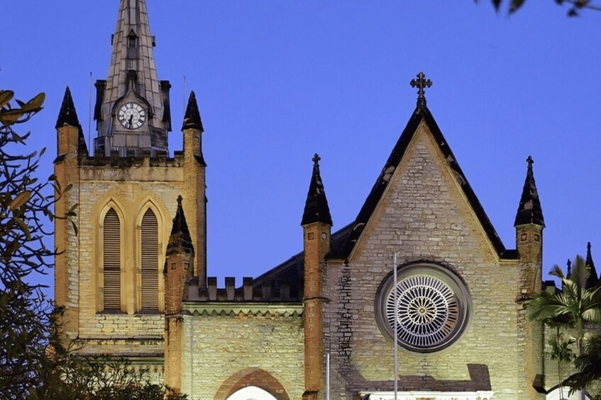 A historic church with a clock tower and pointed spires. 4