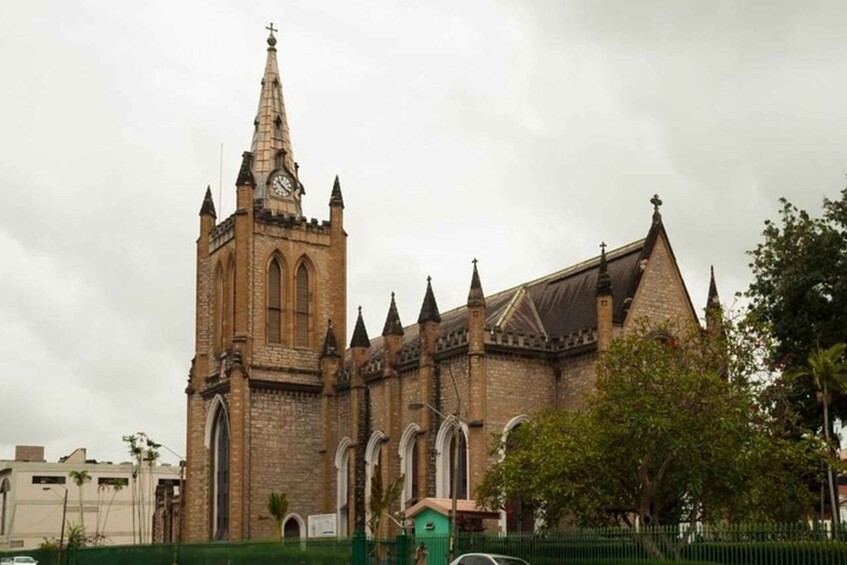 A historic church with a tall spire and clock tower. 5