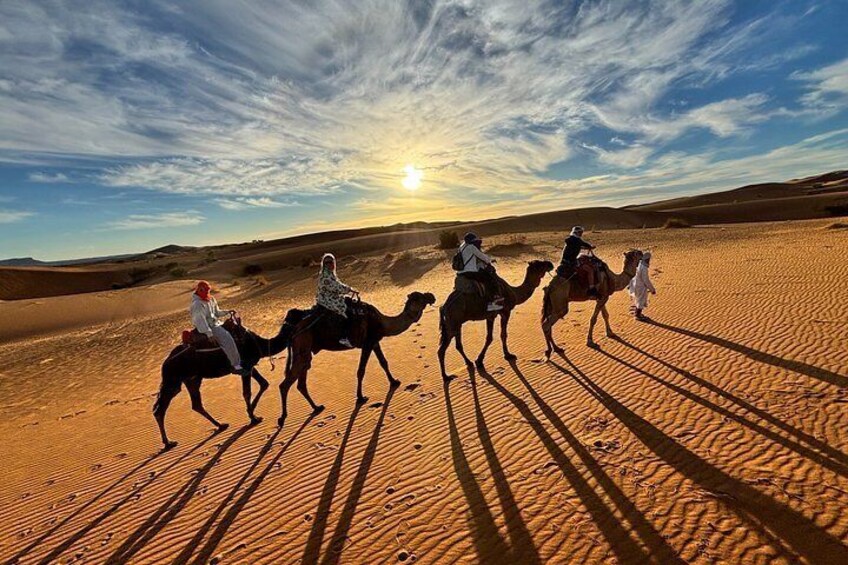 A desert landscape with sand dunes and a clear sky. 1