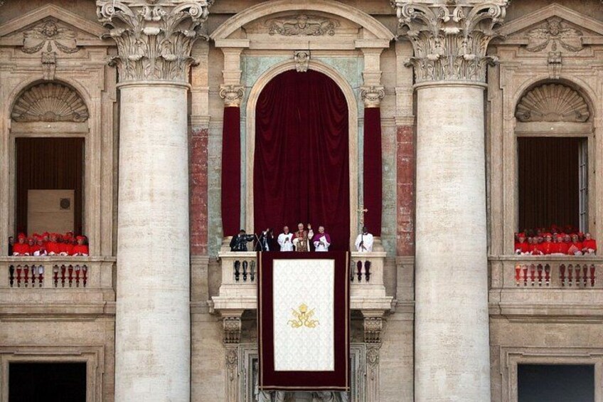 A grand building facade with ornate columns, a large red curtain, and a central podium with a golden emblem. 2