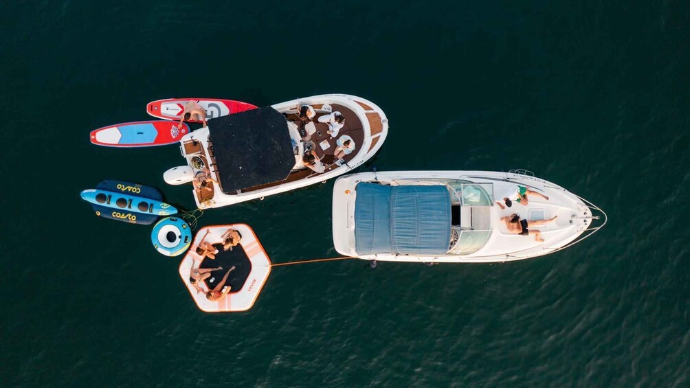 A group of boats anchored in a body of water. 1