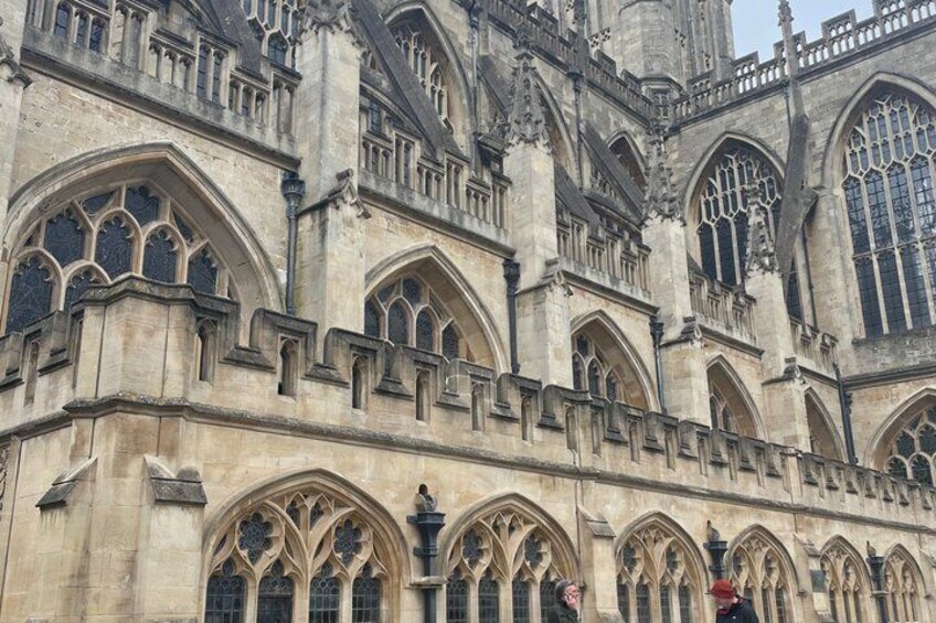 A historic building with arched windows and intricate stonework. 3