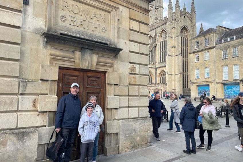 A historic building with a sign reading 'Roman Bath.' 4
