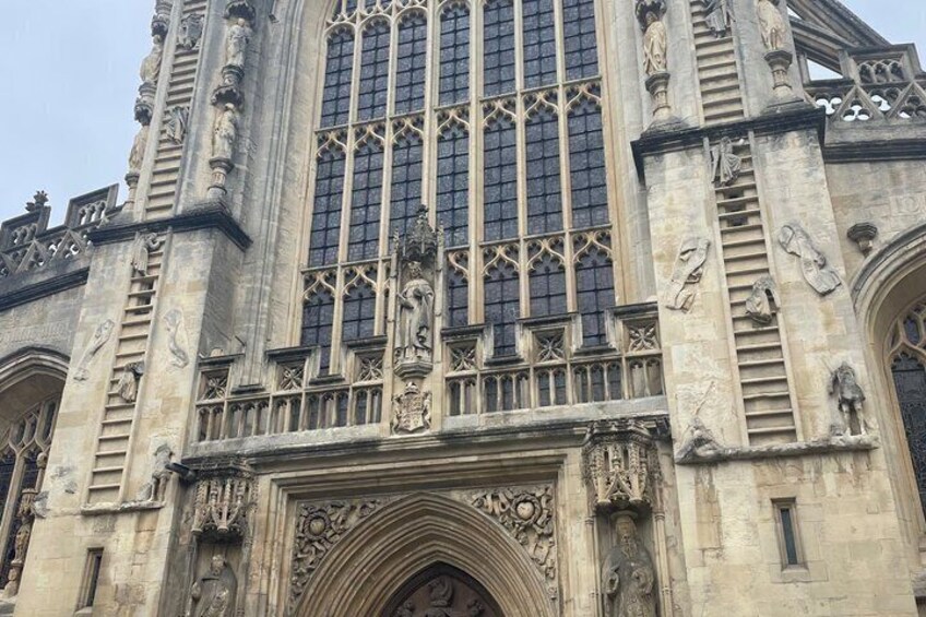 A Gothic-style building with intricate stone carvings and a large arched entrance. 2