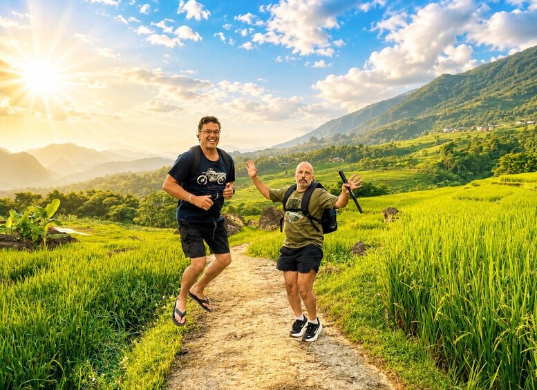 Two people running on a dirt path through a lush green landscape with mountains in the background. 2