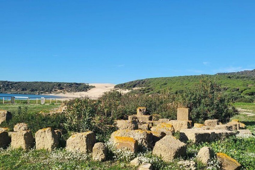 Ancient ruins, a beach, and a hilly landscape. 2