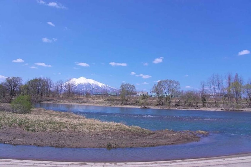 A river with a mountain in the background. 2