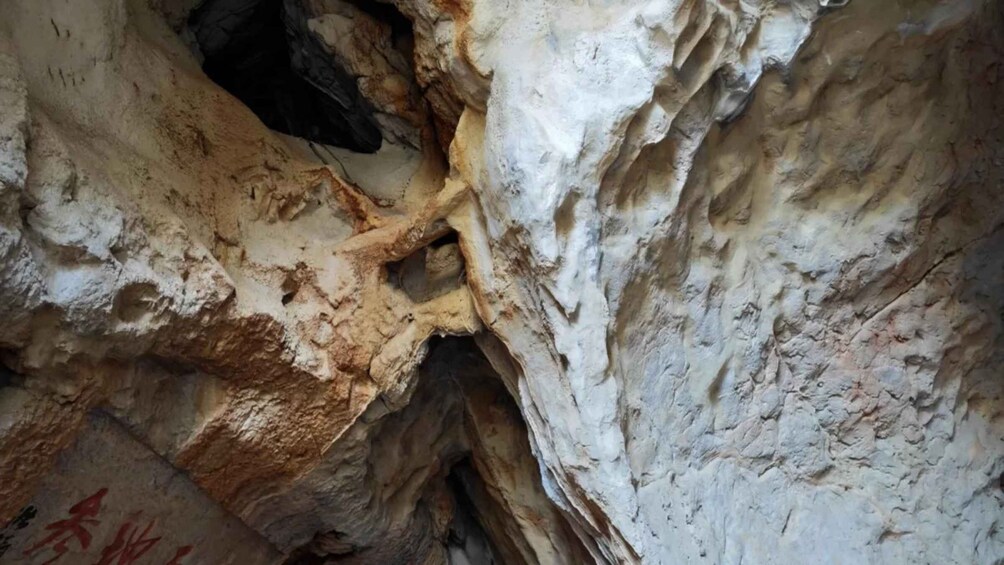 A cave interior with stalactites and stalagmites. 1
