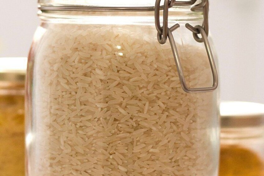 A glass jar filled with white rice, secured with a metal clasp. 3