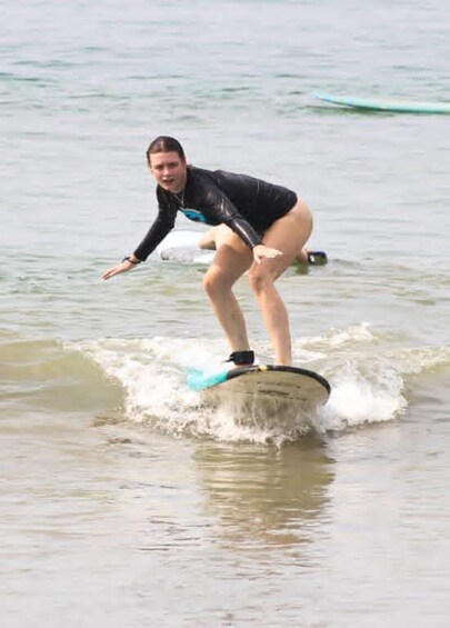 A person surfing on a wave in the ocean. 3