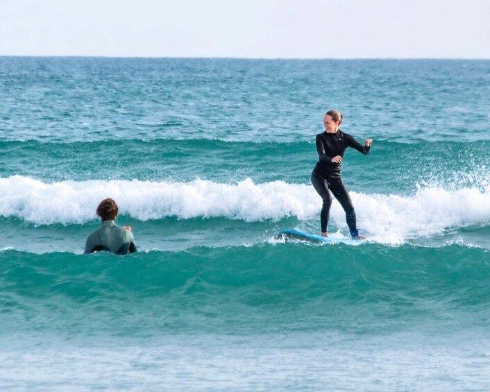 A person surfing on a wave in the ocean. 1