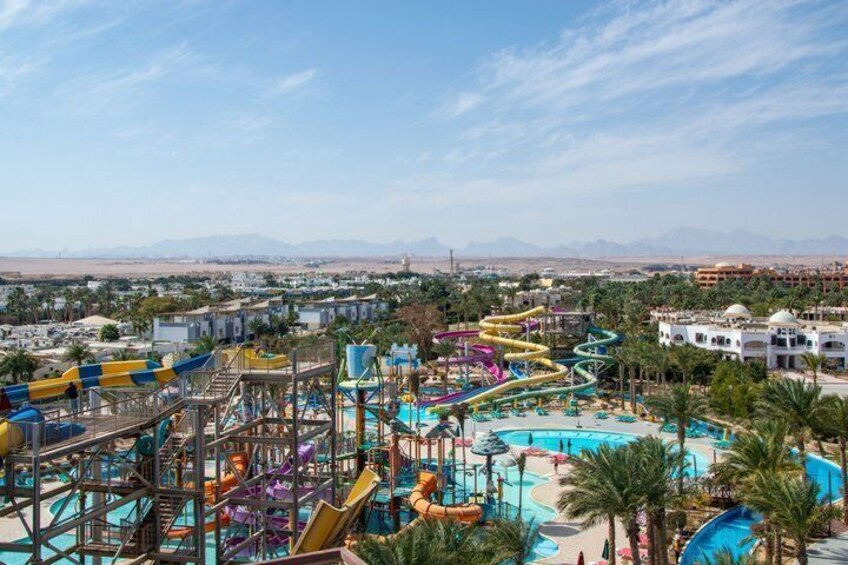 A water park with multiple slides and a pool. 3