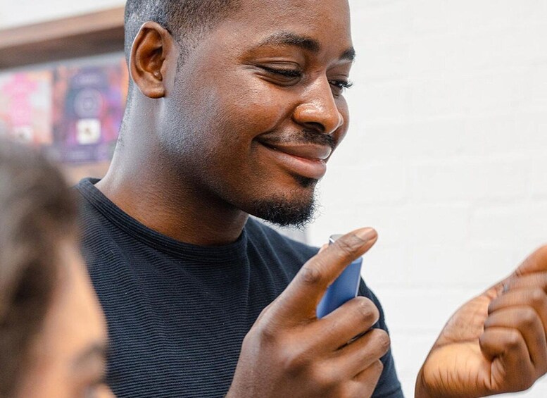 A person holding a smartphone. 3