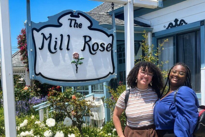 A sign for 'The Mill Rose' with a rose decoration. 2