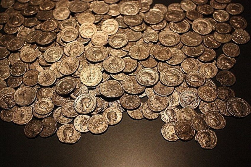 A collection of coins scattered on a surface. 2