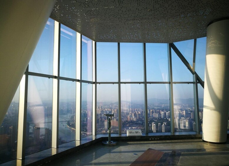 A high-rise interior with large windows overlooking a cityscape. 3