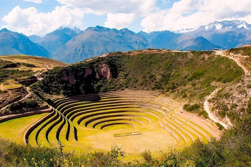 Terraced fields, a winding road, and mountains in the background. 3