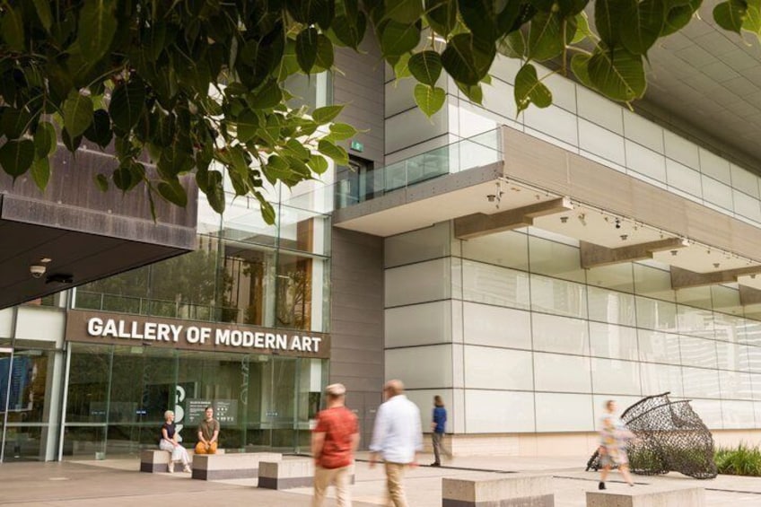 A modern building with a sign reading 'GALLERY OF MODERN ART'. 2