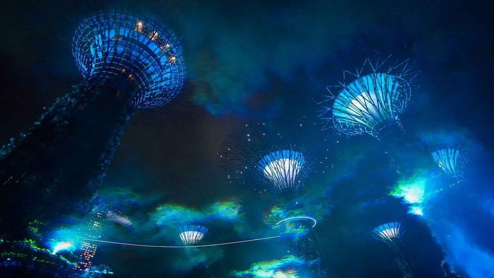 A night scene with illuminated structures resembling domes or towers. 4