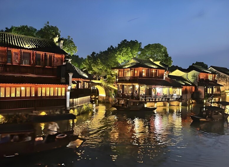 Traditional Chinese architecture along a canal with boats. 3