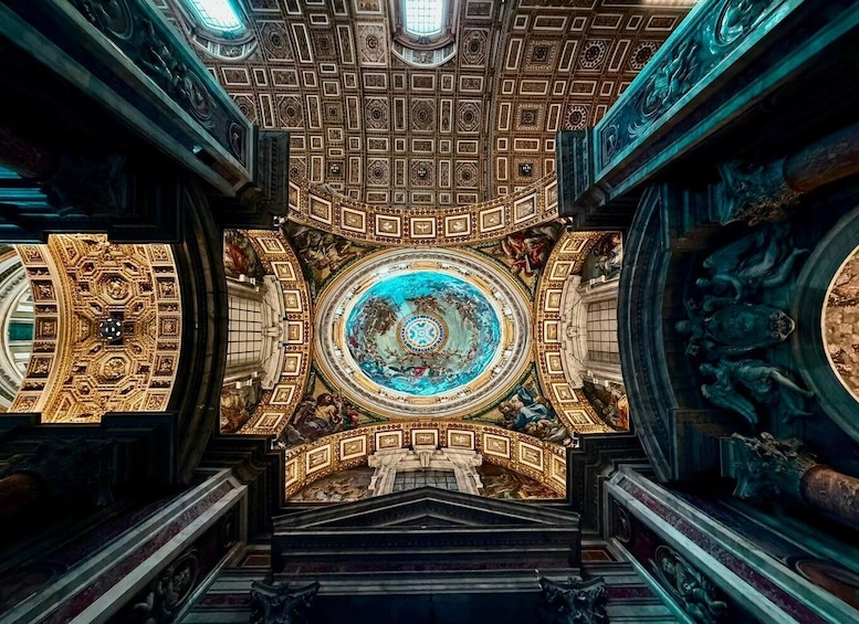 A grand architectural interior with a central circular ceiling, ornate gold detailing, and classical sculptures. 1