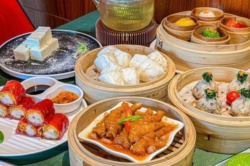 A variety of Asian dishes, including dumplings, sushi, and a dish with chicken. 3