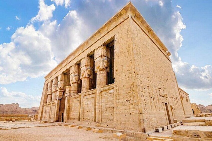 A large ancient Egyptian temple with columns and hieroglyphs. 1