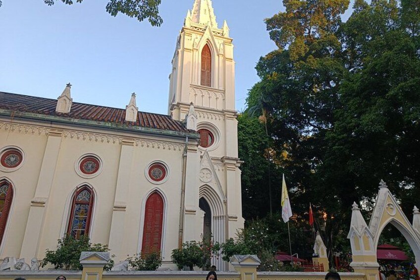 A church with a tall tower and red doors. 3