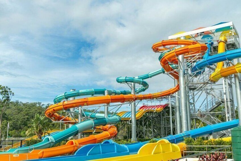 A water park with multiple water slides in various colors. 2