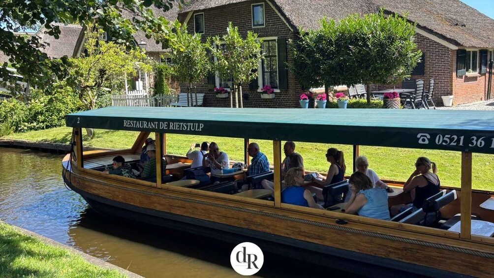 A boat with people dining, a restaurant named 'RESTAURANT DE RIETSTULP' on the side, and a house in the background. 3
