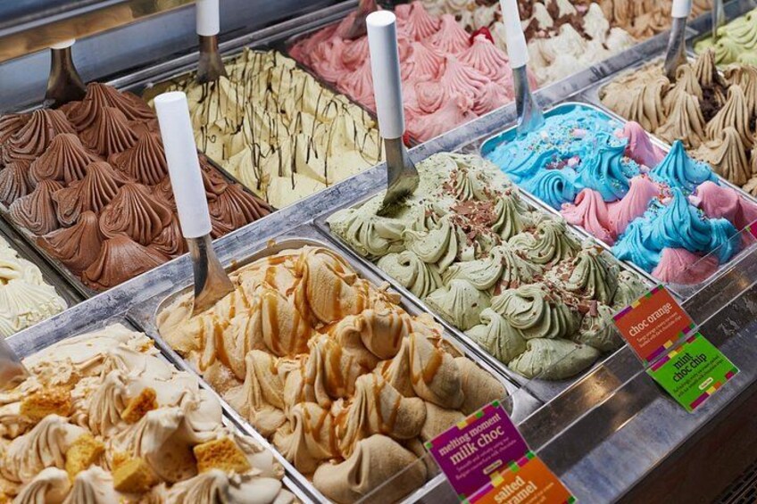 A variety of ice cream flavors in a display case. 3