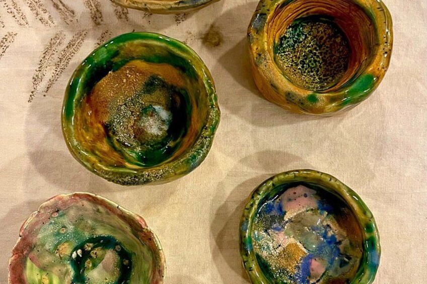 Four ceramic bowls with colorful patterns and designs. 2