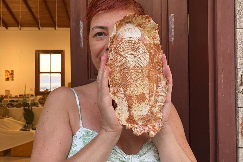 A person holding a large, textured object. 1